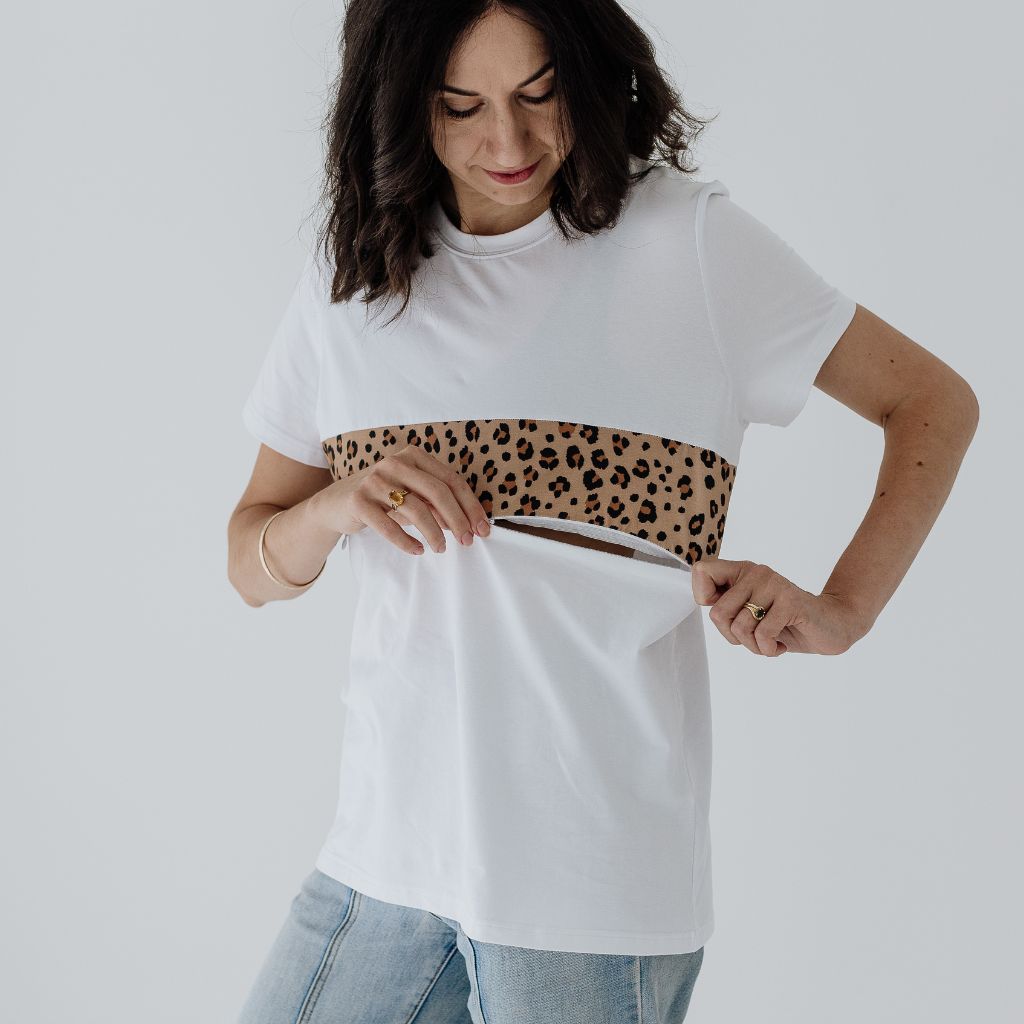 A size S mum wearing a white and leopard print breastfeeding t-shirt with a zip.