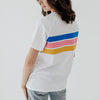 A size 8 mum modeling the back of a white t-shirt with stripes in blue, pink and yellow.